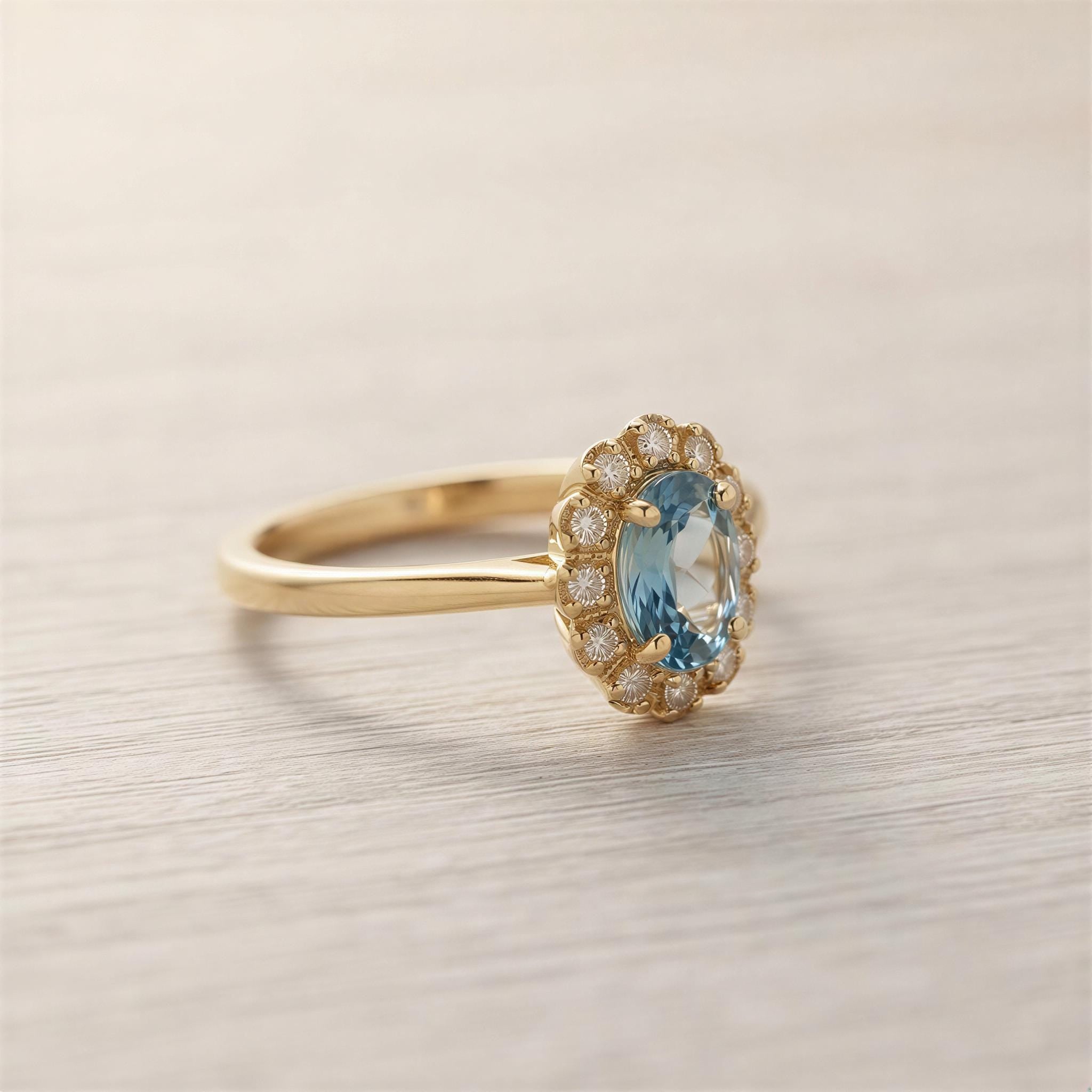A gold ring with a blue gemstone, likely a diamond, set in the center of the band.