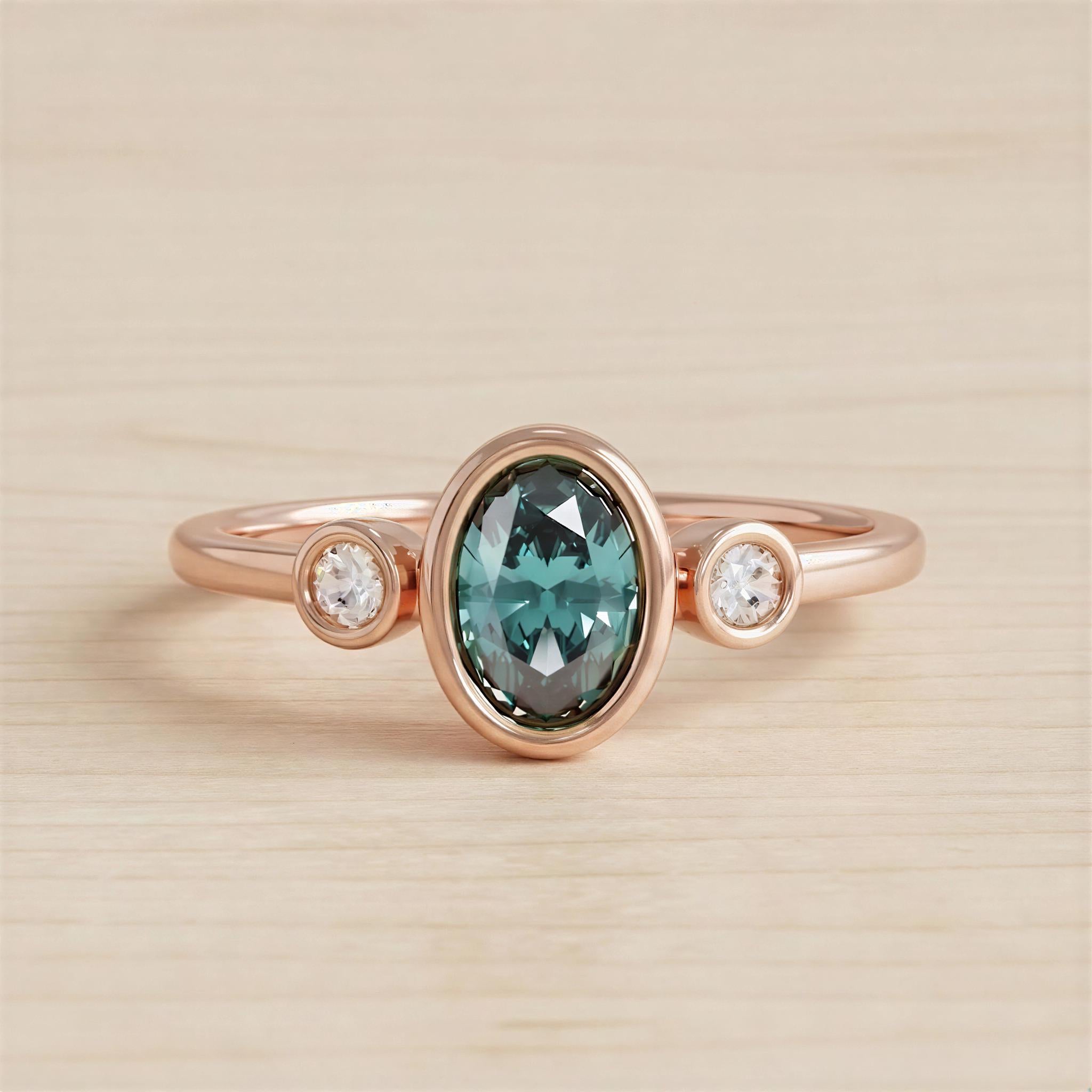 A rose gold ring with a large oval-shaped gemstone in the center, surrounded by smaller round stones.