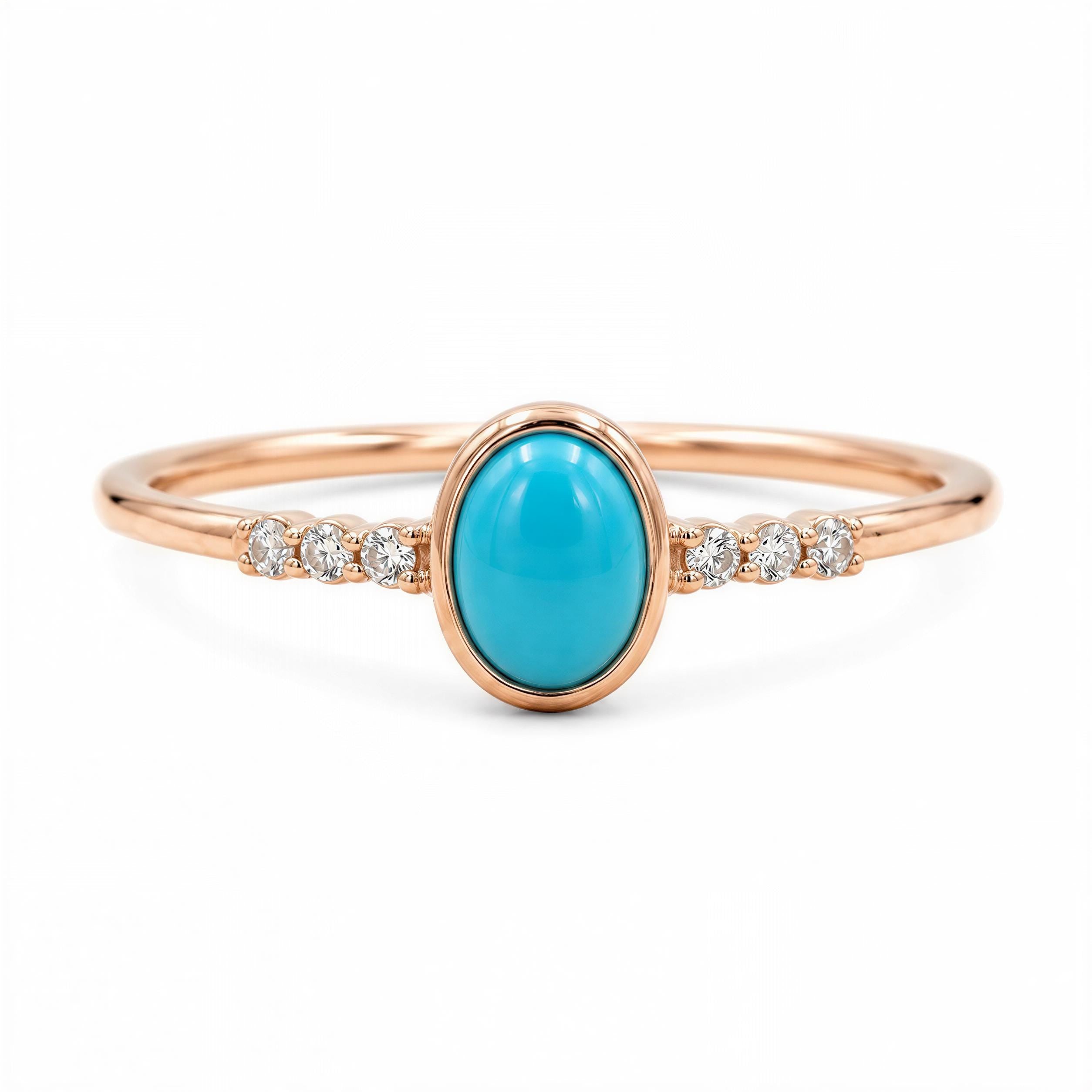 A rose gold ring with a turquoise stone and small diamonds set in the band.