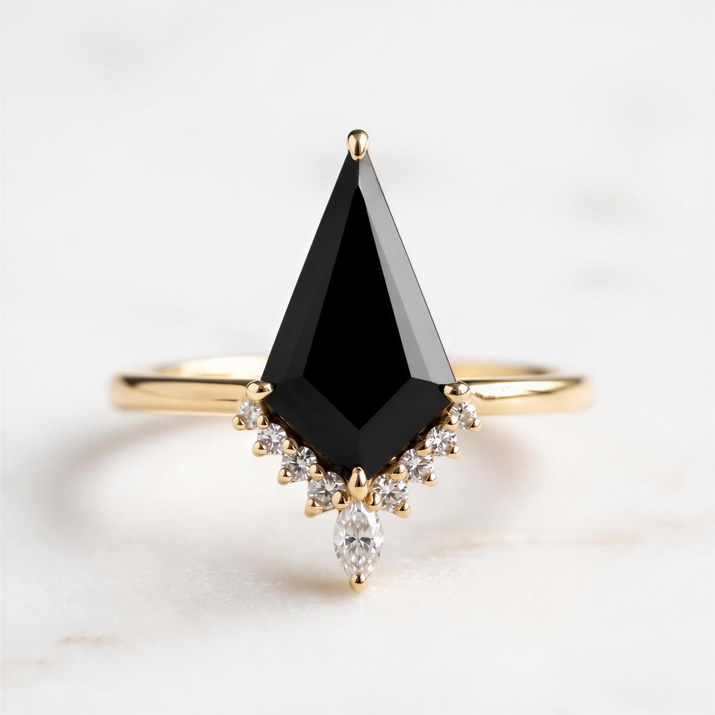 A gold ring with a large black diamond as the centerpiece, surrounded by smaller diamonds.