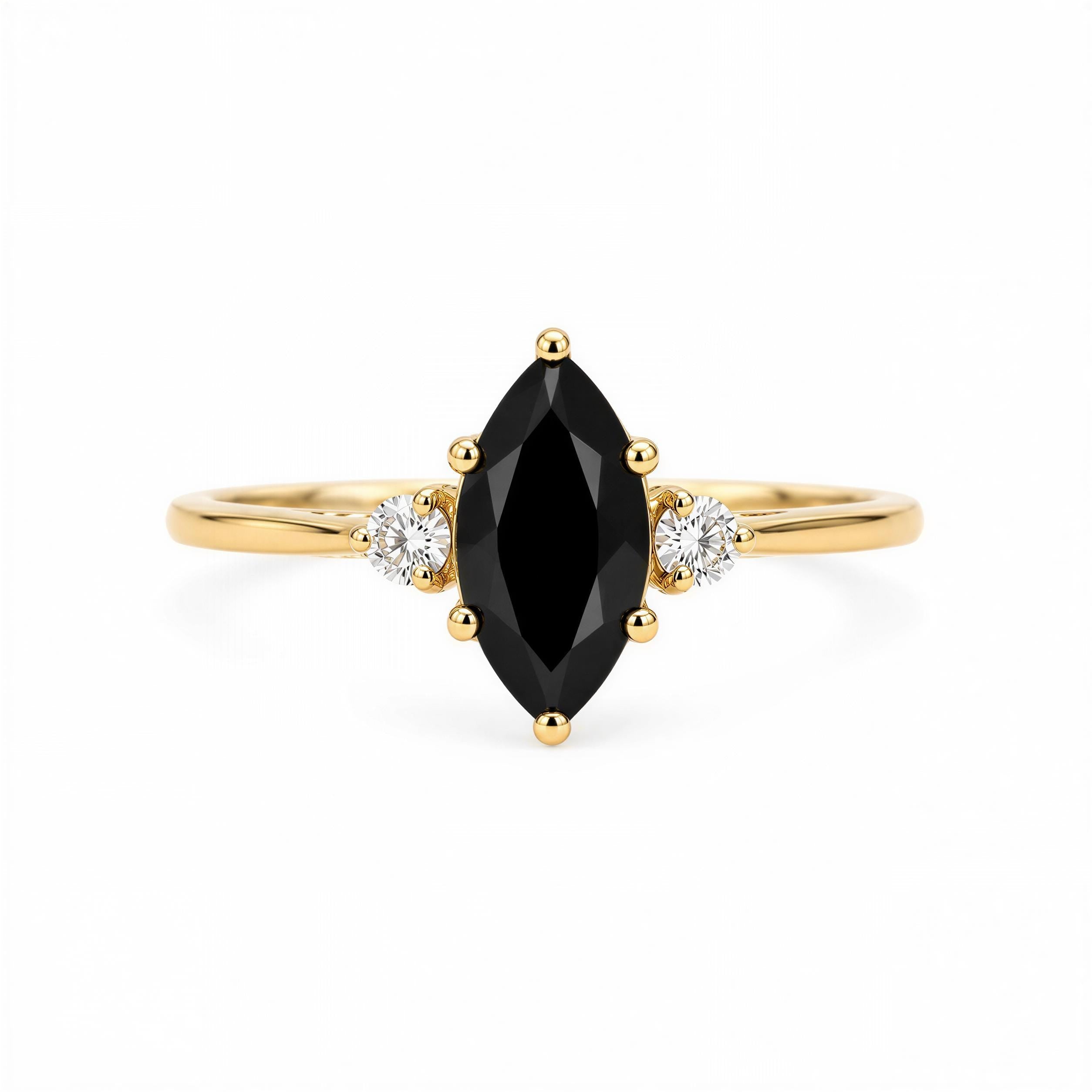 A gold ring with a large black gemstone in the center, surrounded by smaller diamonds.