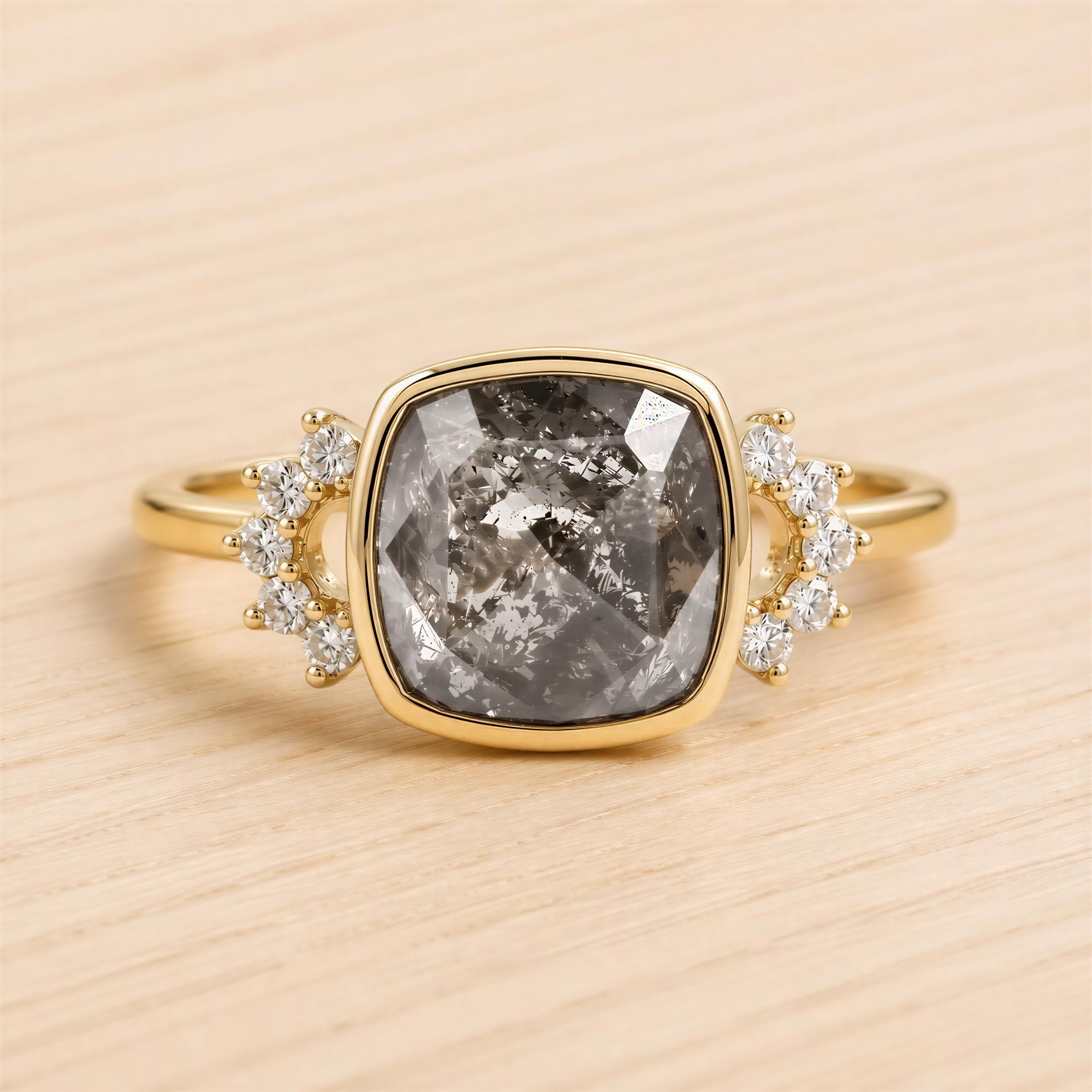 A gold ring with a large, square-cut diamond as the centerpiece, surrounded by smaller diamonds.