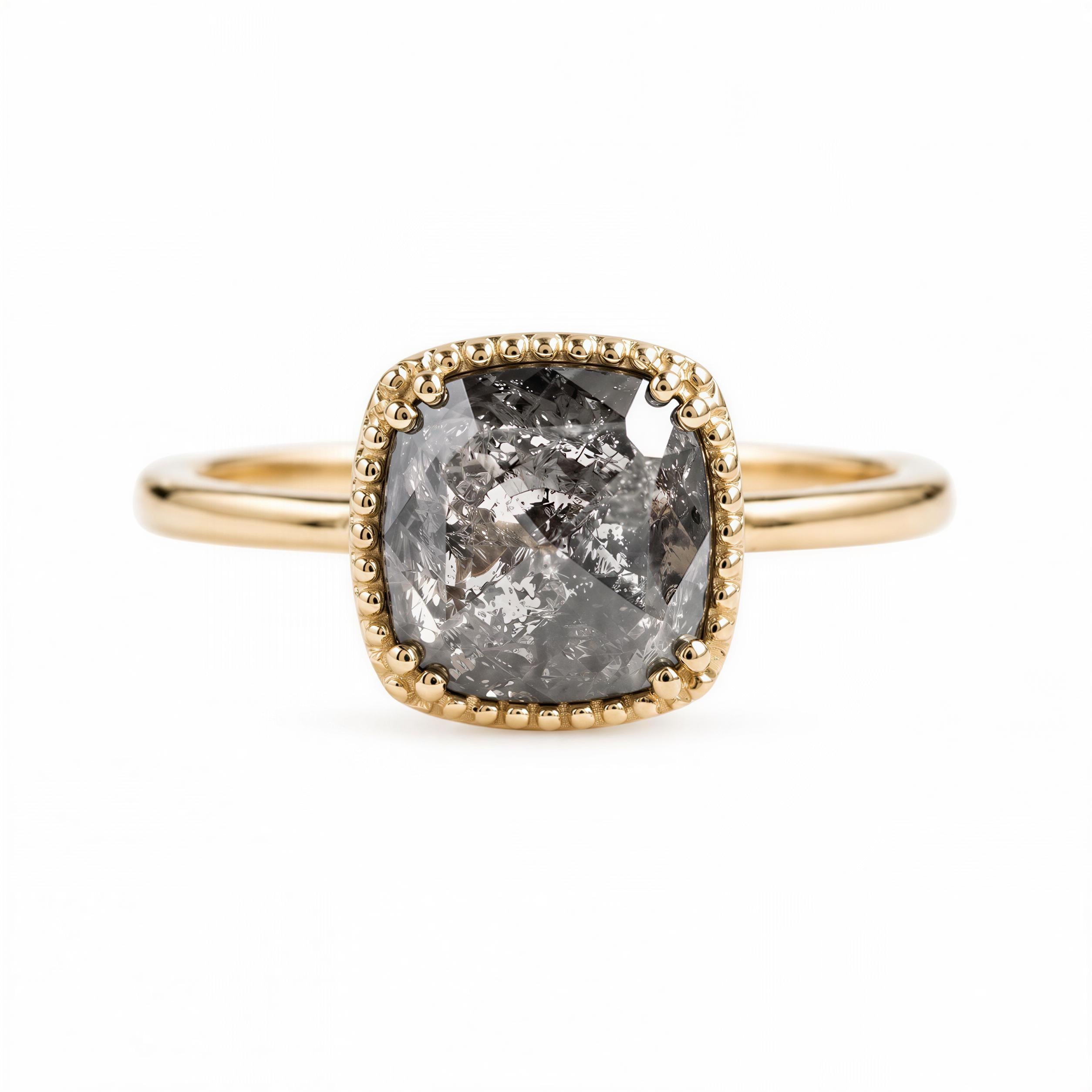 A gold ring with a large, irregularly shaped diamond as the centerpiece.