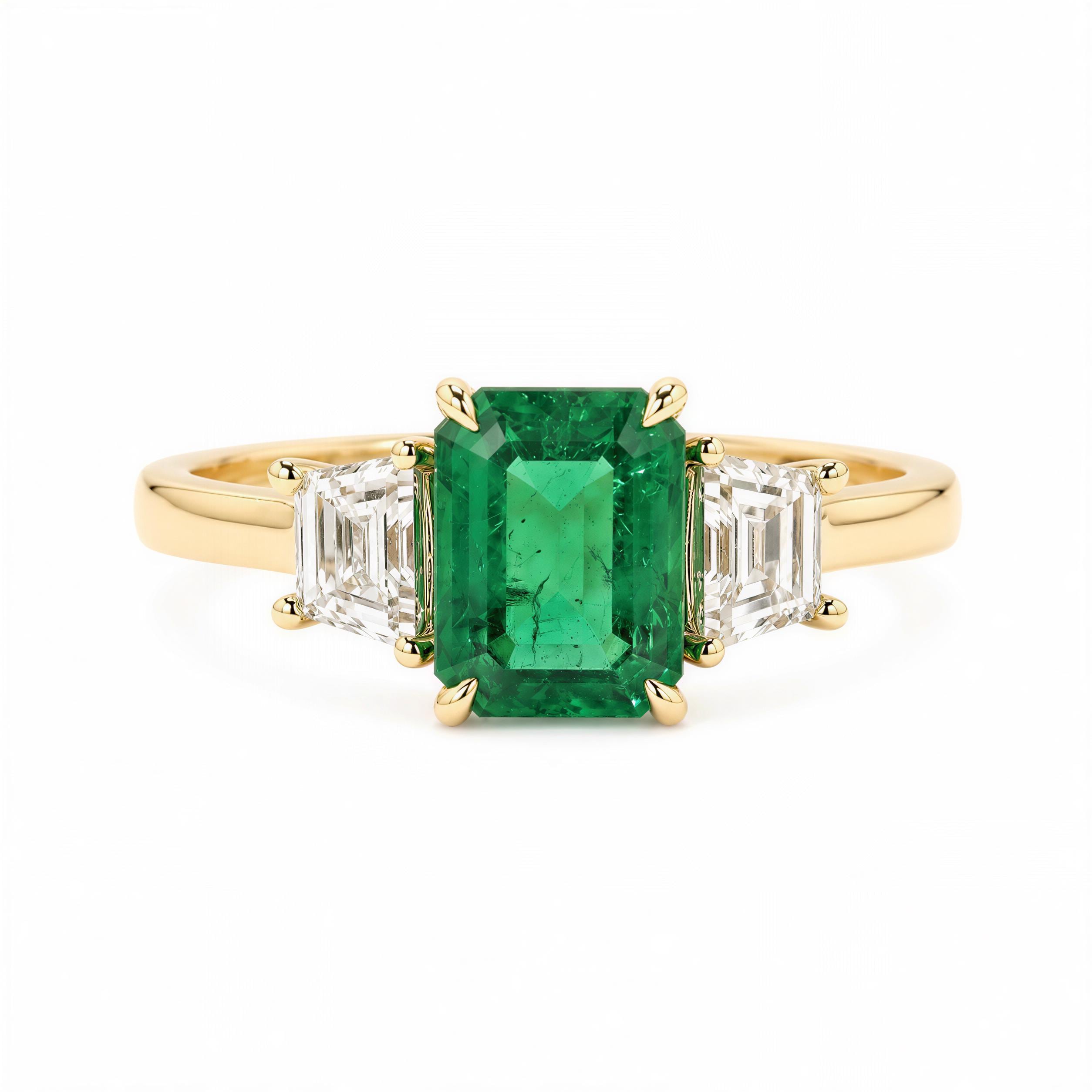A gold ring with a large, vibrant green emerald gemstone in the center, surrounded by smaller diamonds.