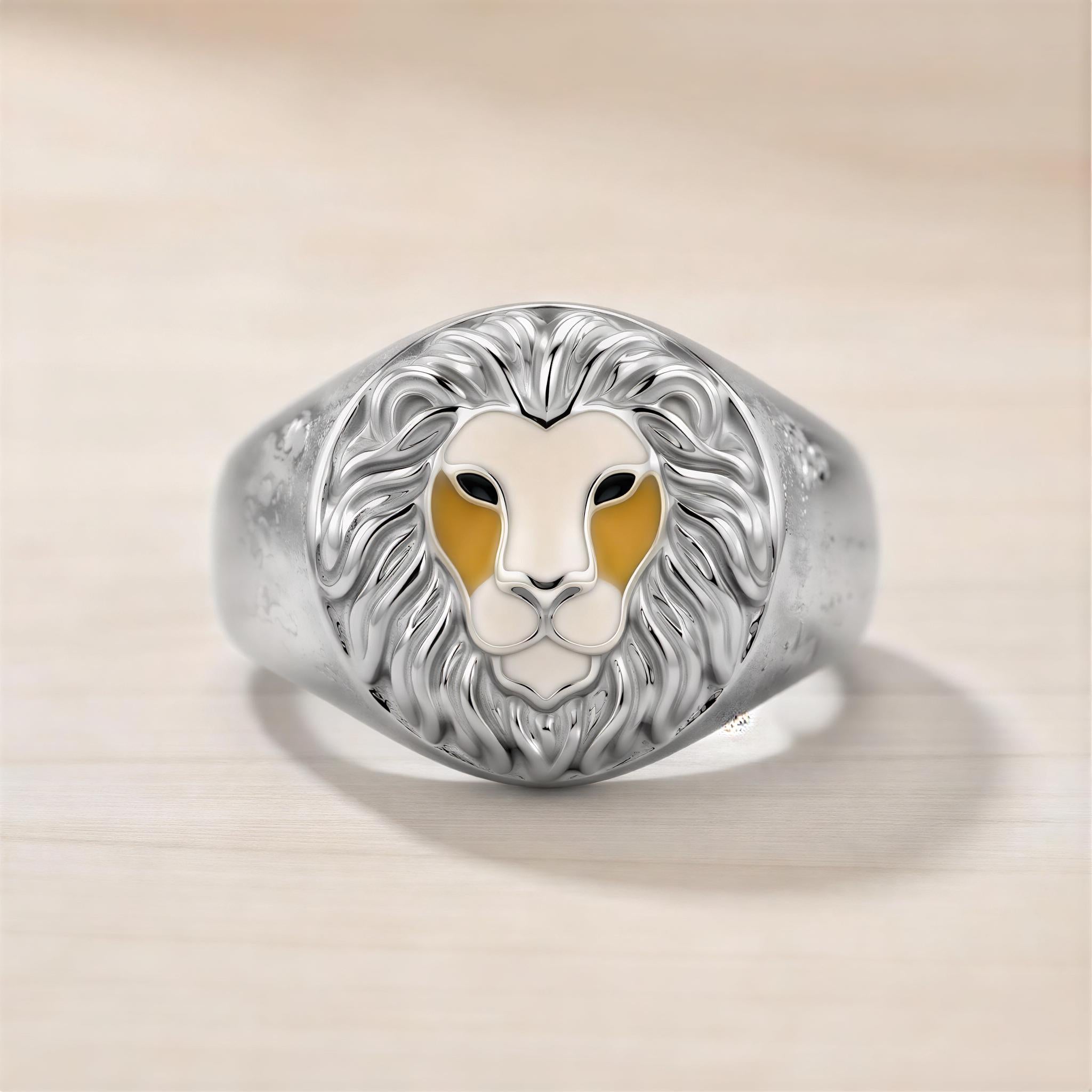 A silver ring with a detailed lion's head design in the center.