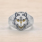 A silver ring with a detailed design of a wolf's head.