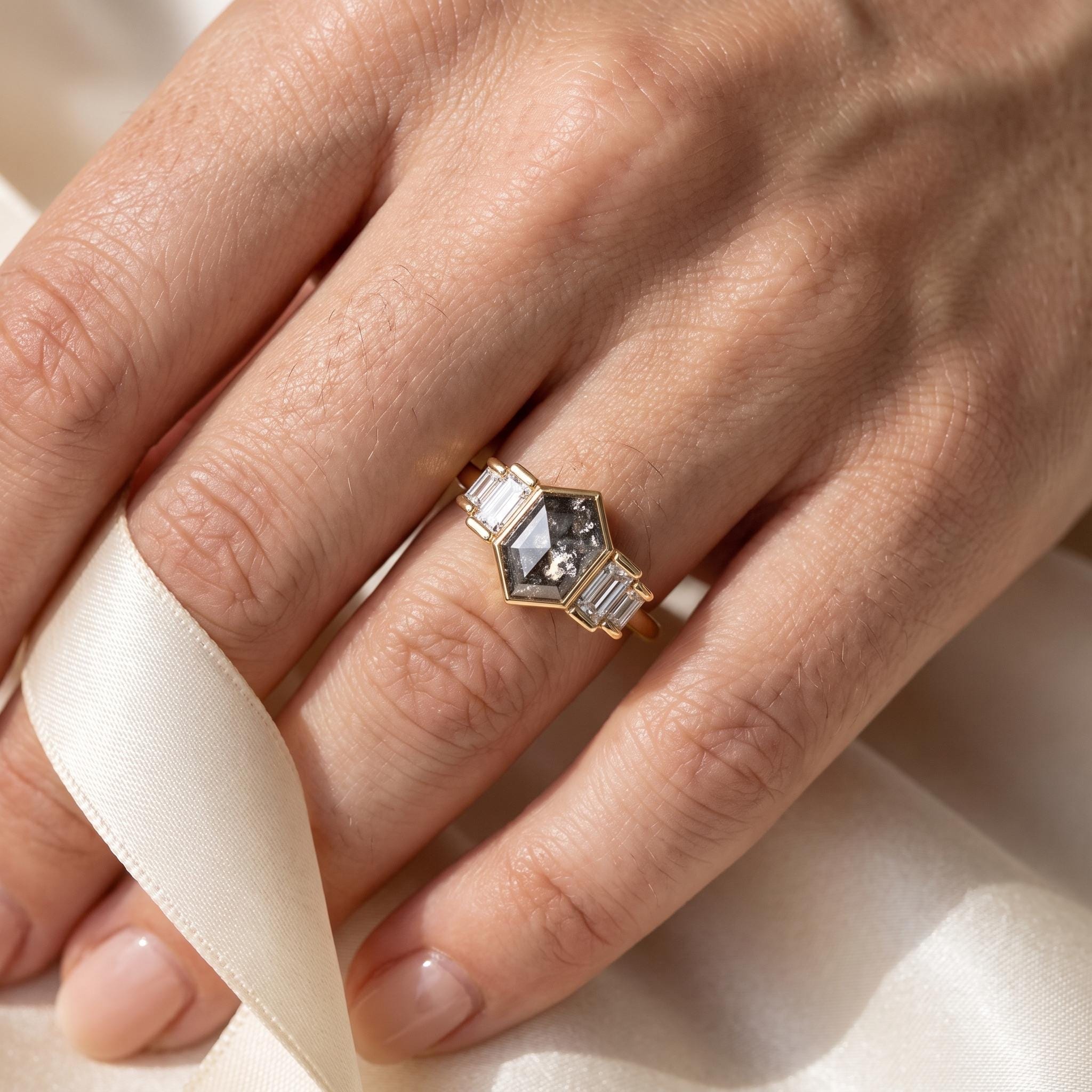 Side view of 14K yellow gold five stone diamond ring