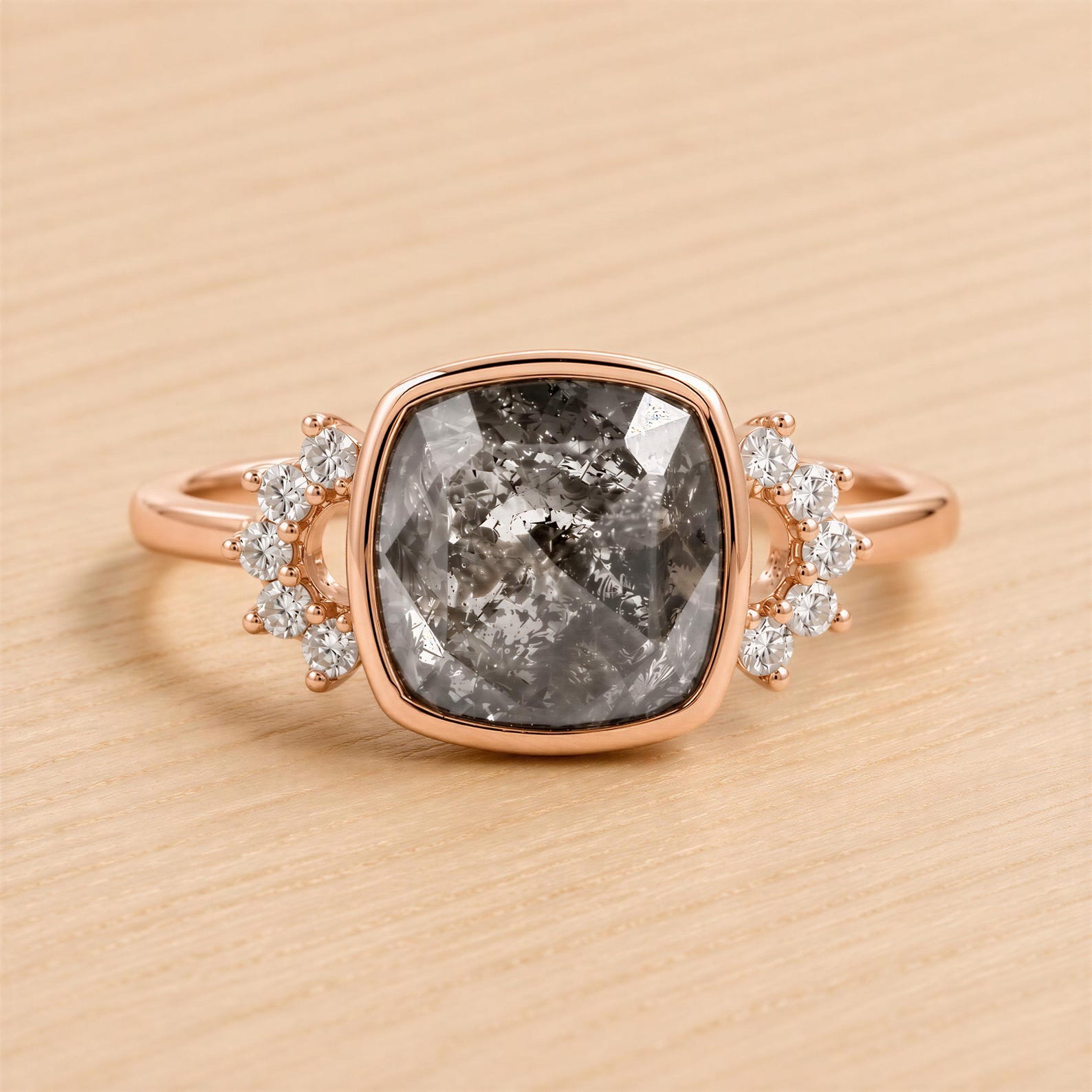 A ring with a large, square-cut diamond as the centerpiece, surrounded by smaller diamonds on either side.