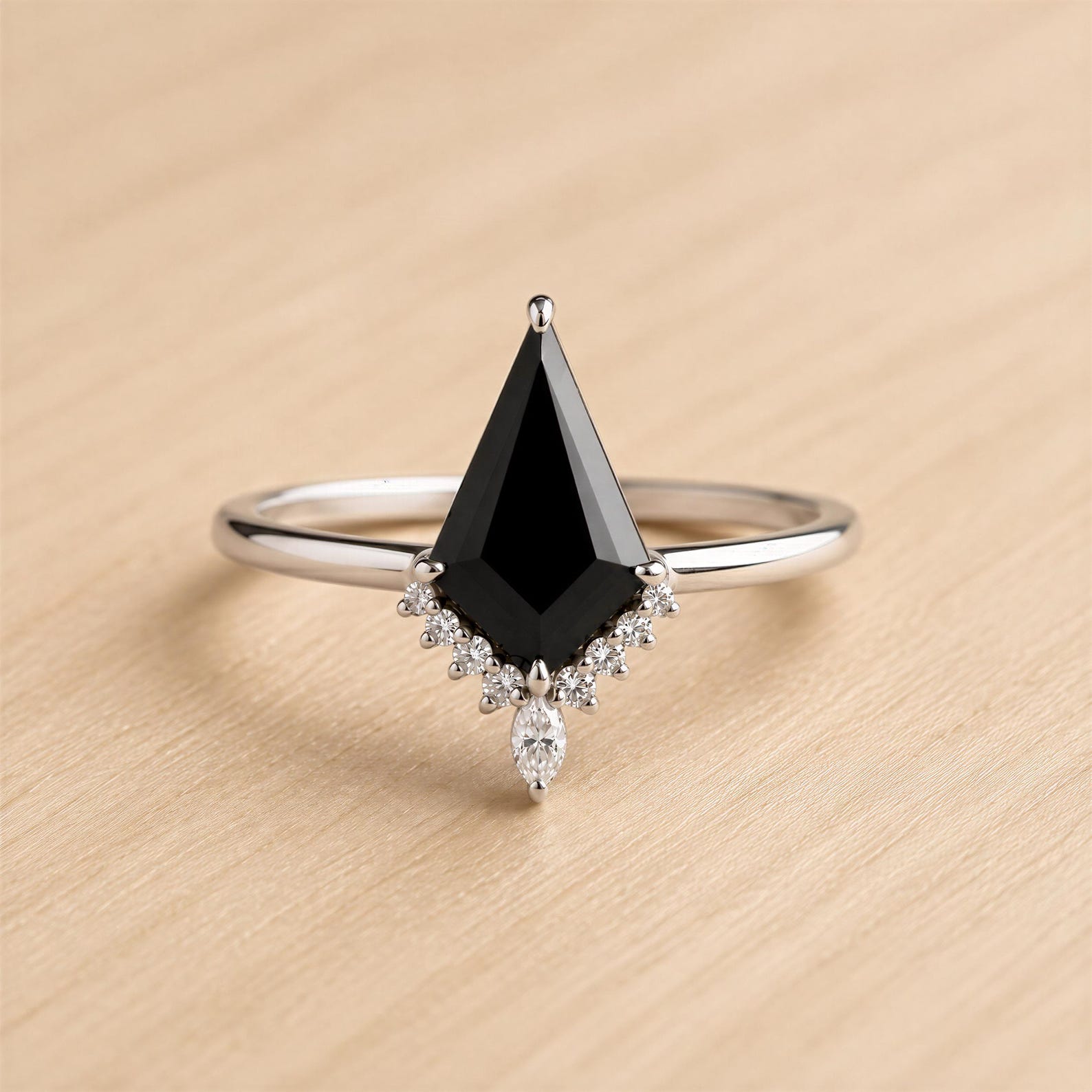 A ring with a large black diamond as the centerpiece, surrounded by smaller diamonds.