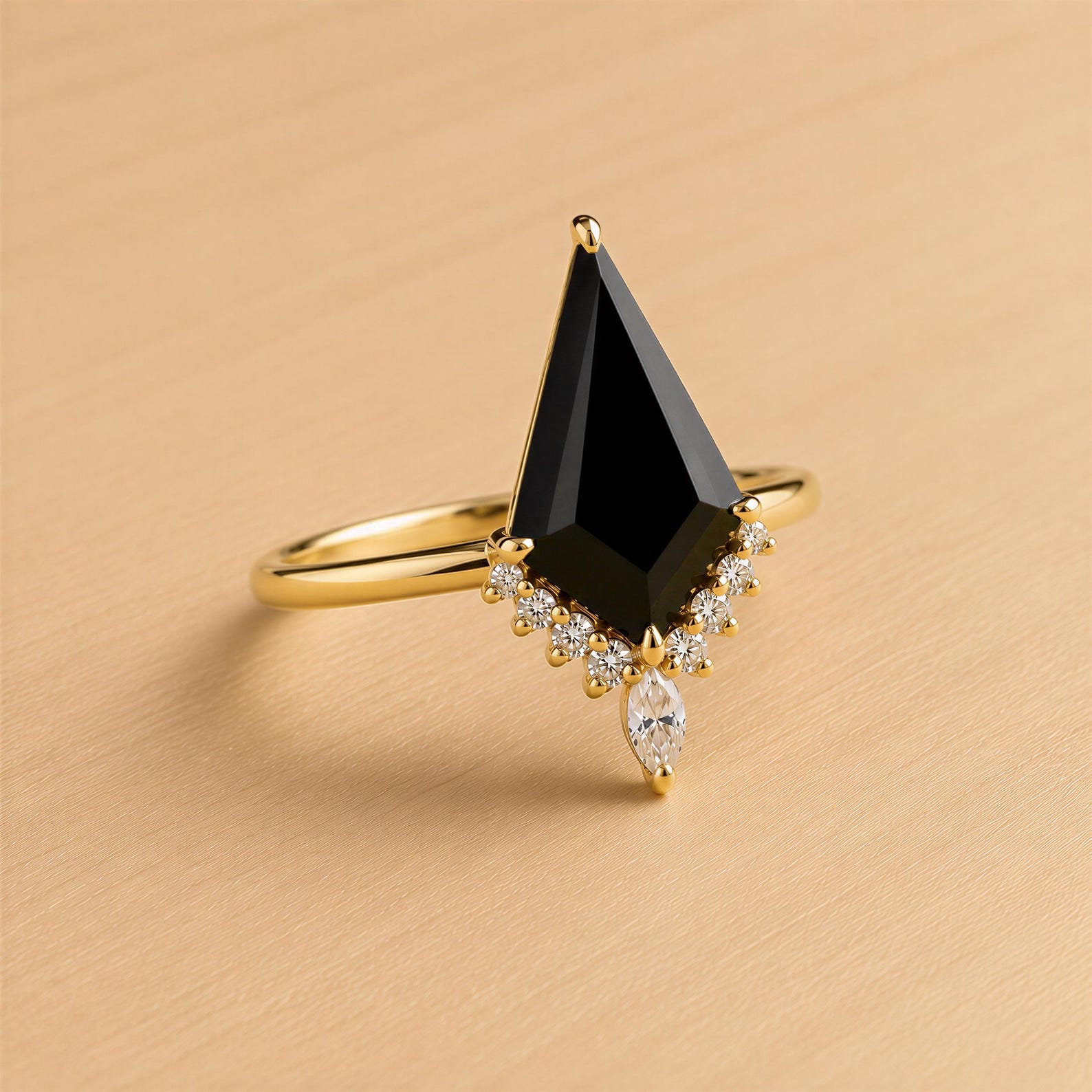 A gold ring with a large black diamond as the centerpiece, surrounded by smaller diamonds.
