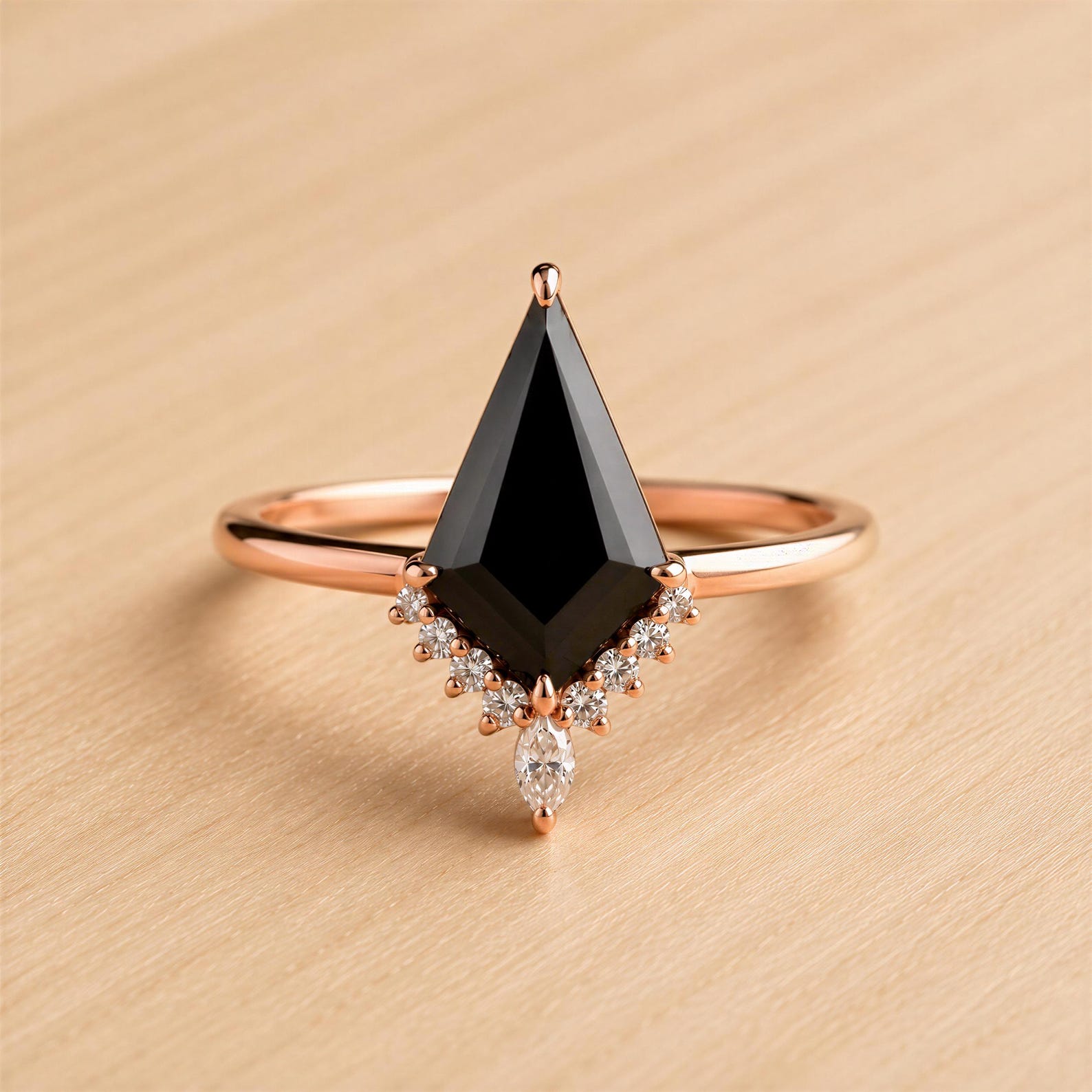 A ring with a large black diamond as the centerpiece, surrounded by smaller diamonds and a rose gold band.