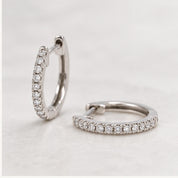 Natural diamond huggie hoop earrings, white front view