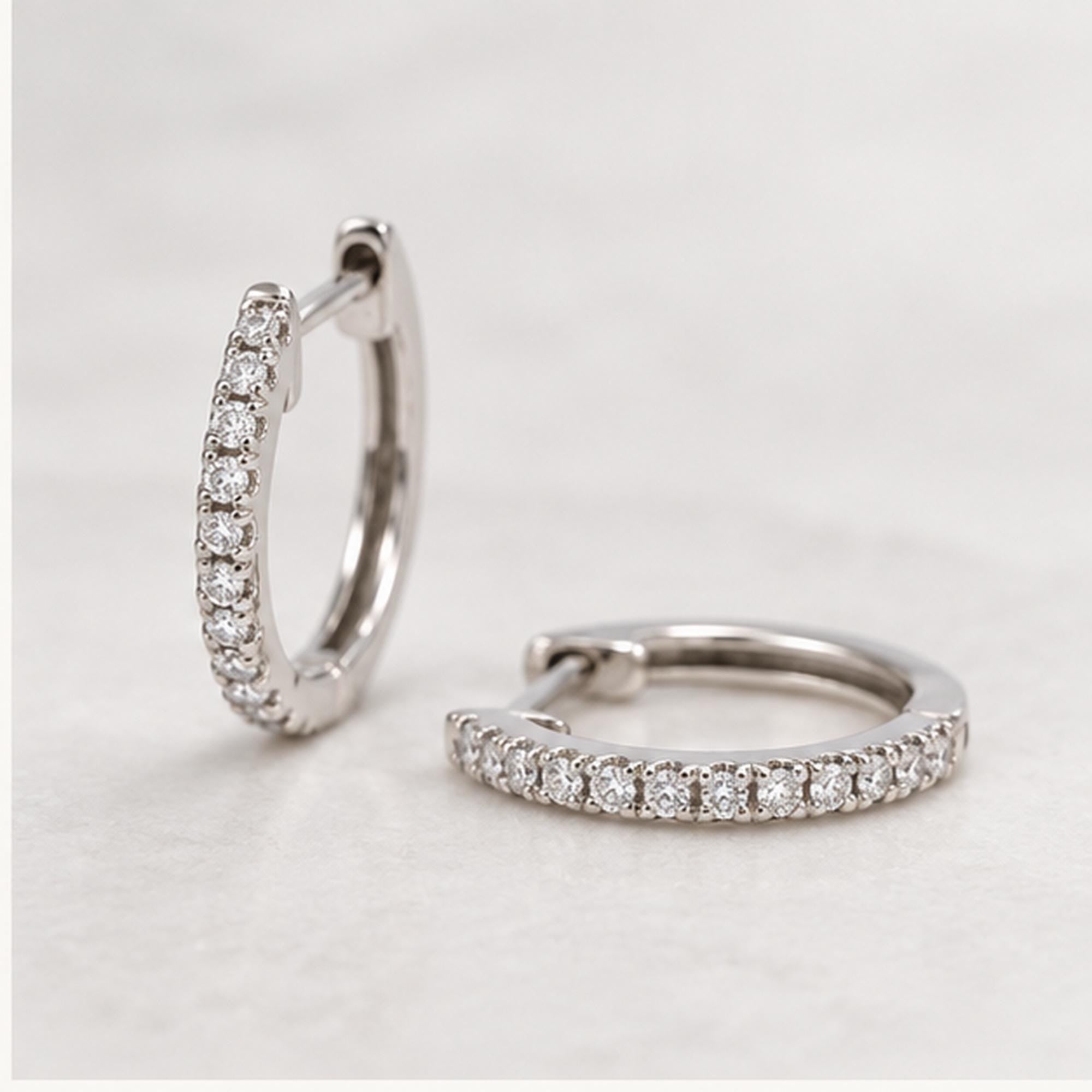 Natural diamond huggie hoop earrings, white front view