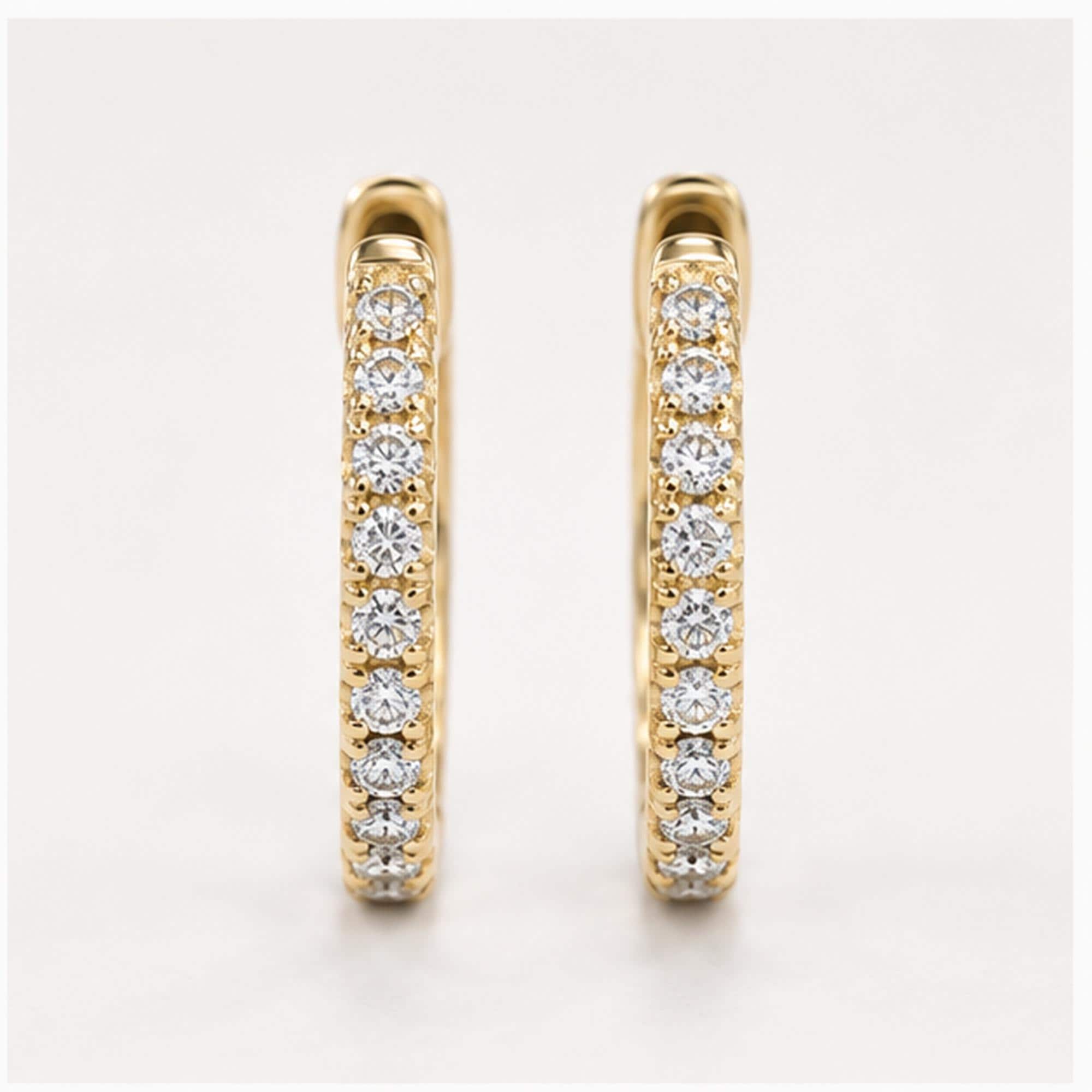 Natural diamond huggie hoop earrings, yellow angle view