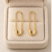 Solid gold safety pin earrings, box view