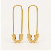Solid gold safety pin earrings, yellow angle view