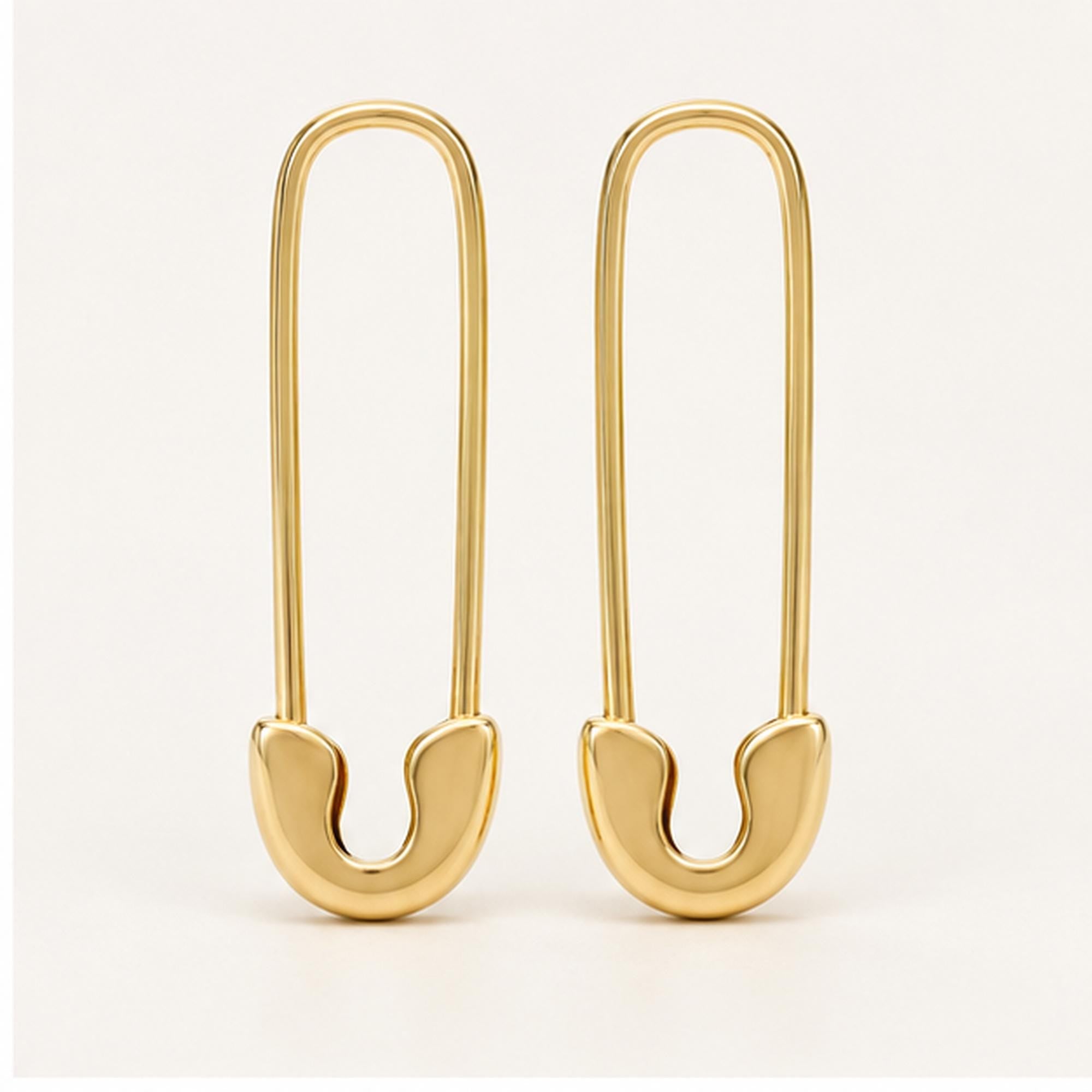 Solid gold safety pin earrings, yellow angle view