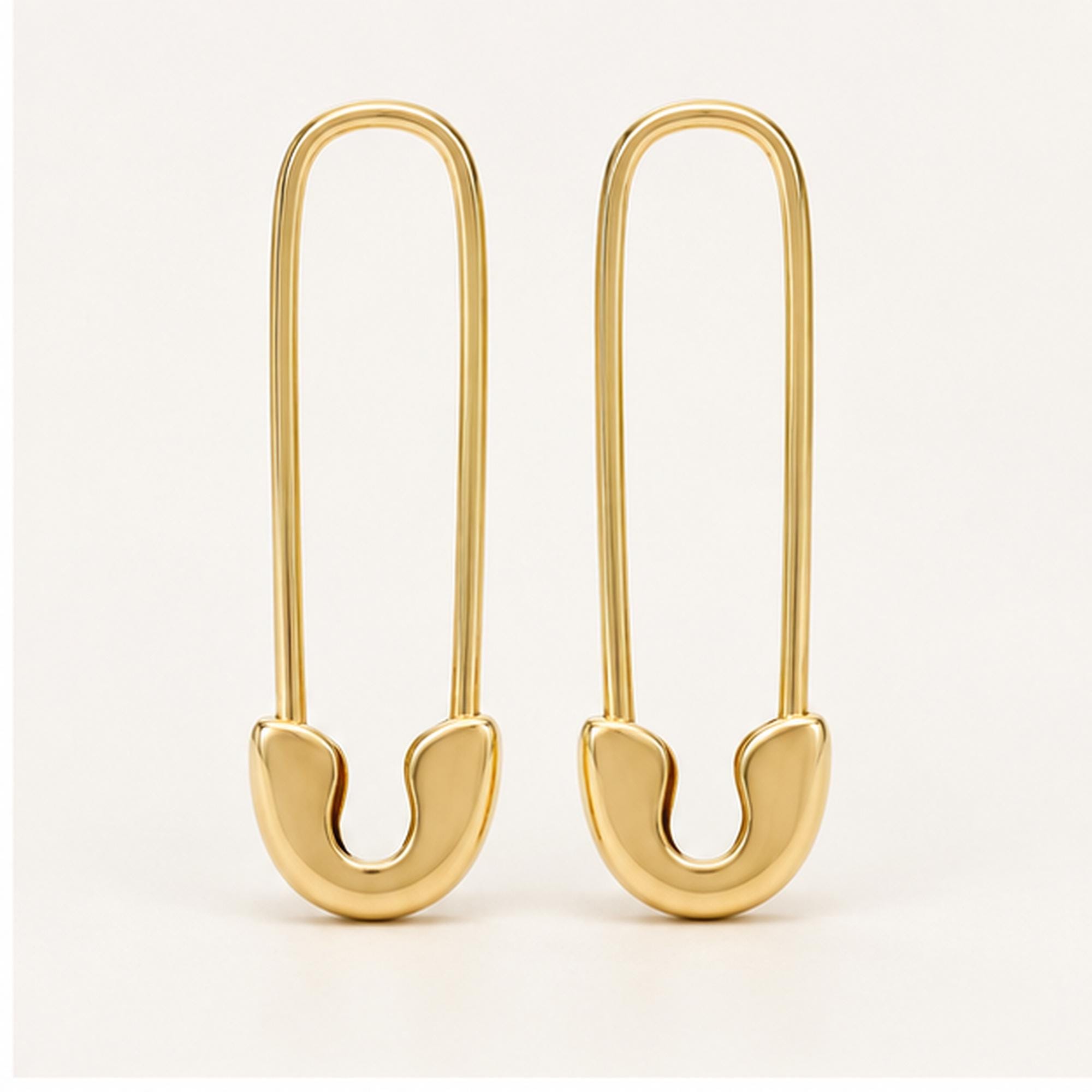 Solid gold safety pin earrings, yellow angle view