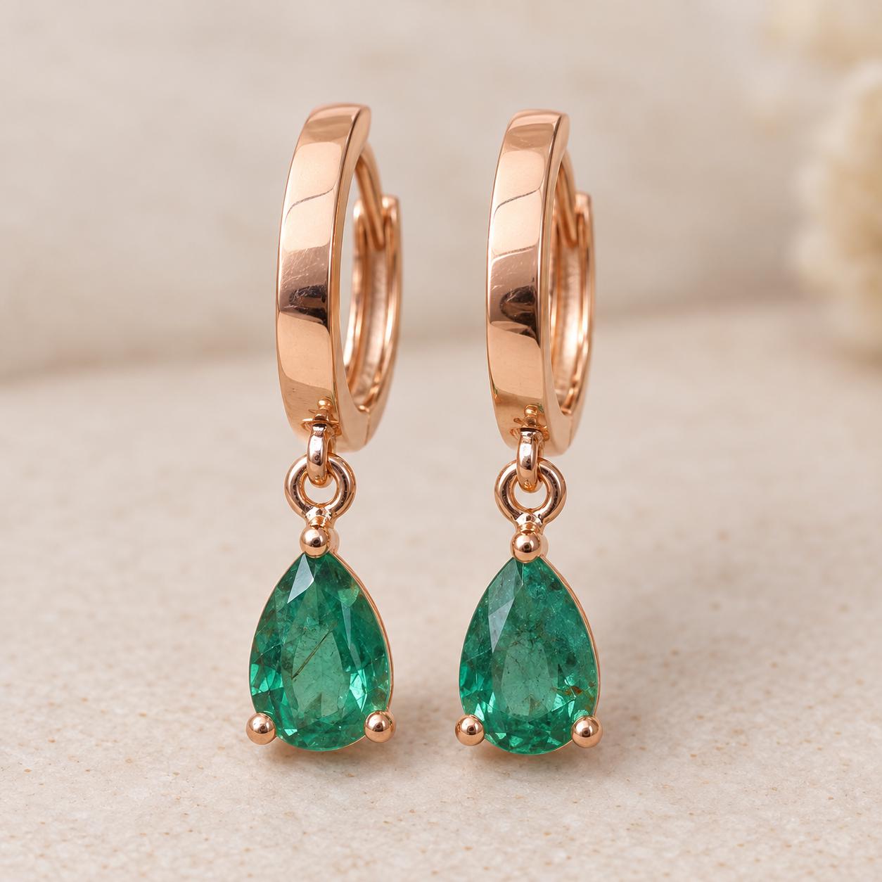 14K rose gold emerald drop huggies, front view